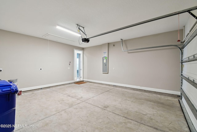 garage with electric panel, baseboards, and a garage door opener