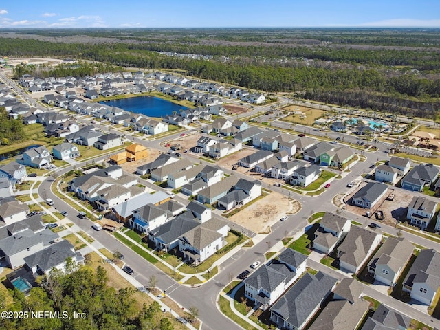 aerial view with a residential view and a water view