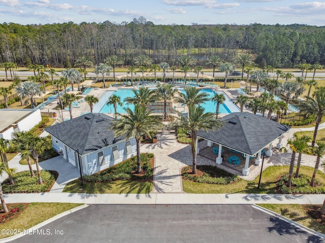 bird's eye view featuring a wooded view