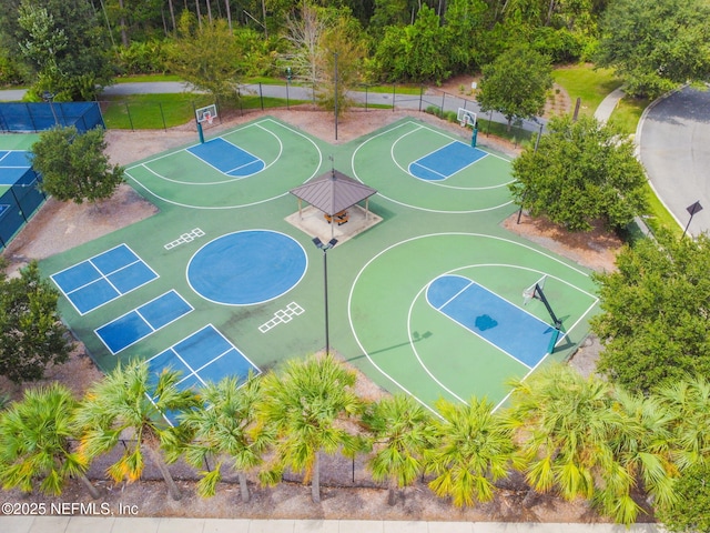 view of basketball court featuring community basketball court and fence