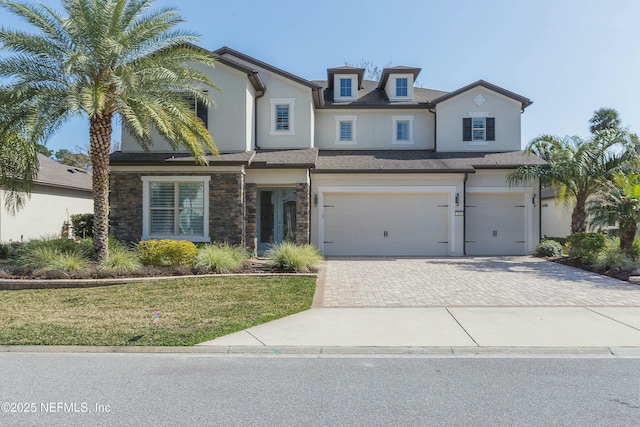 view of front facade featuring a garage and a front lawn