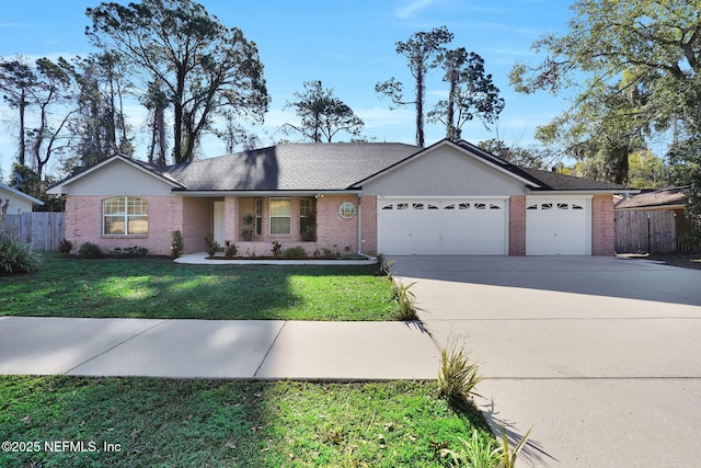 ranch-style home with an attached garage, fence, driveway, stucco siding, and a front lawn