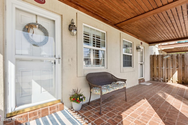 property entrance featuring a porch