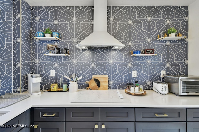 758 Acosta St, Jacksonville, FL 32204 - kitchen featuring backsplash, gray cabinetry, ventilation hood, and white electric stovetop