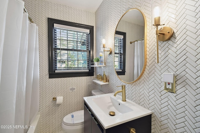758 Acosta St, Jacksonville, FL 32204 - bathroom featuring vanity, toilet, a shower with shower curtain, and tile walls