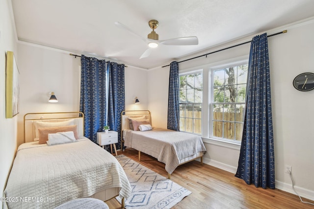 758 Acosta St, Jacksonville, FL 32204 - bedroom with crown molding, ceiling fan, and light wood-type flooring