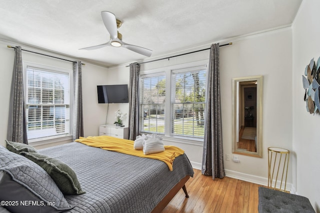 758 Acosta St, Jacksonville, FL 32204 - bedroom with ornamental molding, a textured ceiling, ceiling fan, and light wood-type flooring