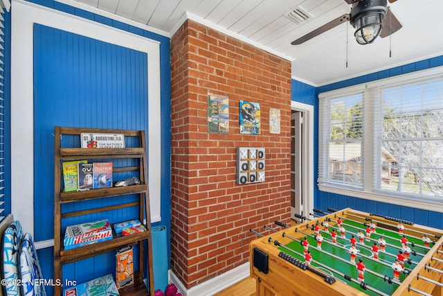 758 Acosta St, Jacksonville, FL 32204 - game room with ceiling fan, ornamental molding, brick wall, and a wealth of natural light