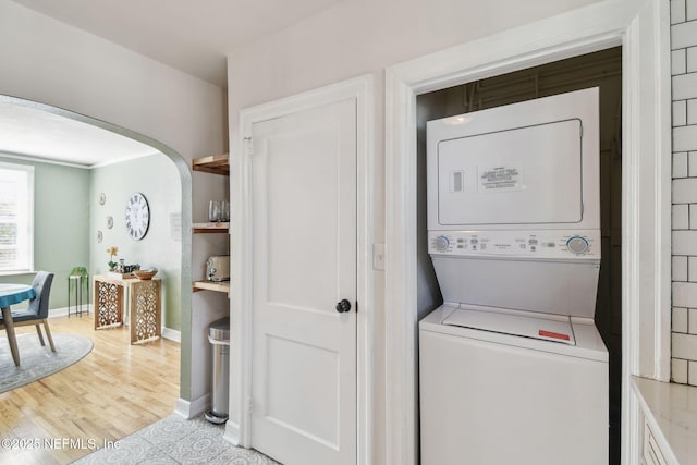 758 Acosta St, Jacksonville, FL 32204 - laundry area featuring stacked washer / dryer and light hardwood / wood-style floors