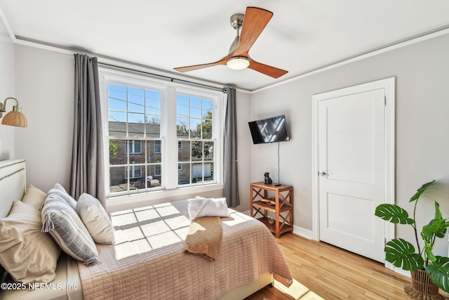 758 Acosta St, Jacksonville, FL 32204 - bedroom featuring ornamental molding, ceiling fan, and light wood-type flooring