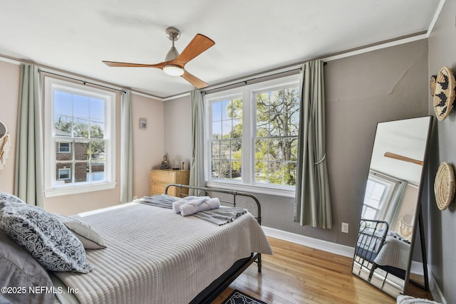 758 Acosta St, Jacksonville, FL 32204 - bedroom with crown molding, ceiling fan, and light hardwood / wood-style flooring