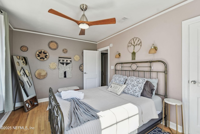 758 Acosta St, Jacksonville, FL 32204 - bedroom featuring light hardwood / wood-style flooring, ornamental molding, and ceiling fan