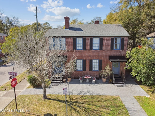 758 Acosta St, Jacksonville, FL 32204 - view of front of property with a front lawn and a patio