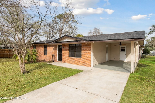 ranch-style house featuring a carport and a front yard