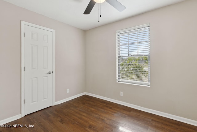 unfurnished room with dark wood-type flooring and ceiling fan