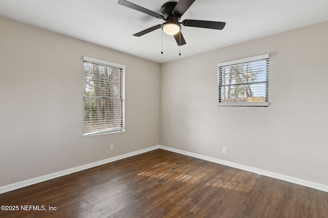 spare room featuring ceiling fan and dark hardwood / wood-style flooring