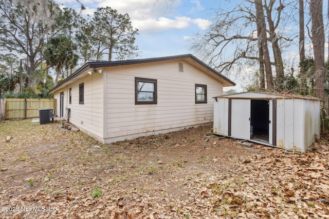 exterior space featuring a storage shed and central air condition unit