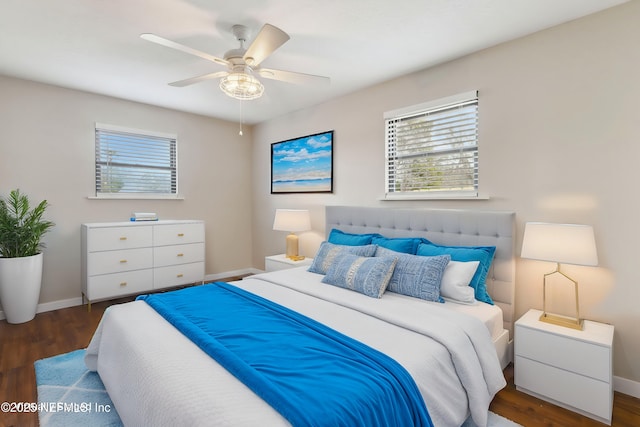 bedroom featuring dark hardwood / wood-style floors and ceiling fan