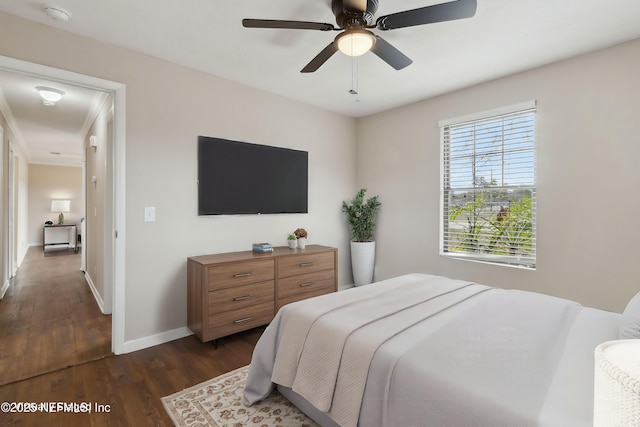 bedroom with dark hardwood / wood-style floors and ceiling fan