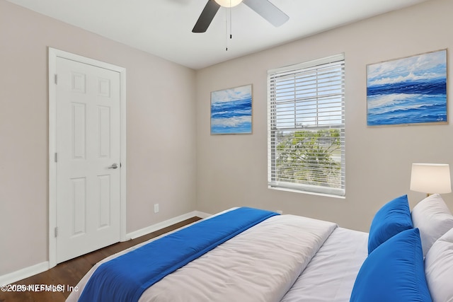 bedroom featuring dark wood-type flooring and ceiling fan