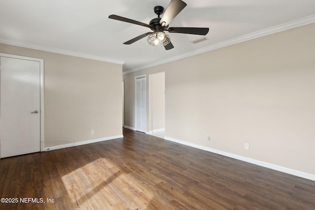 empty room with dark wood-type flooring, ceiling fan, and ornamental molding