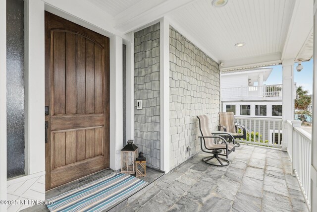 doorway to property featuring a balcony