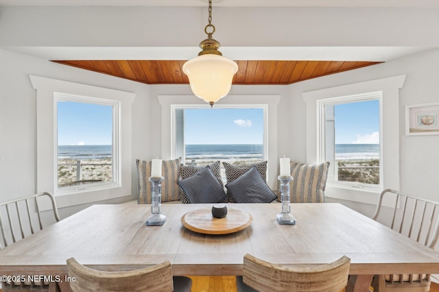 dining space with wood ceiling