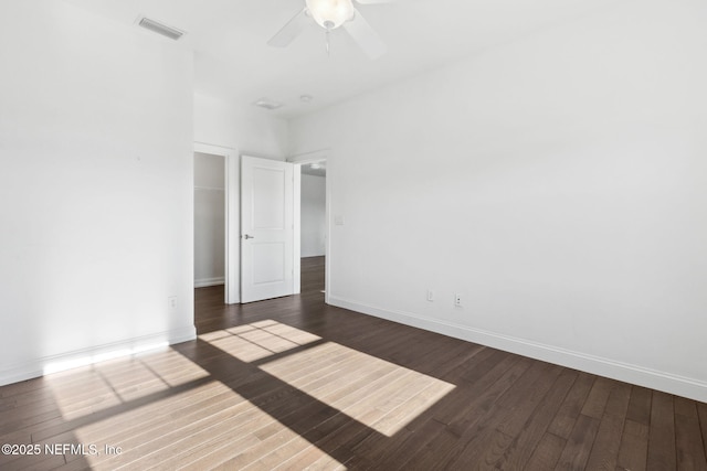 unfurnished bedroom with visible vents, dark wood finished floors, baseboards, and ceiling fan