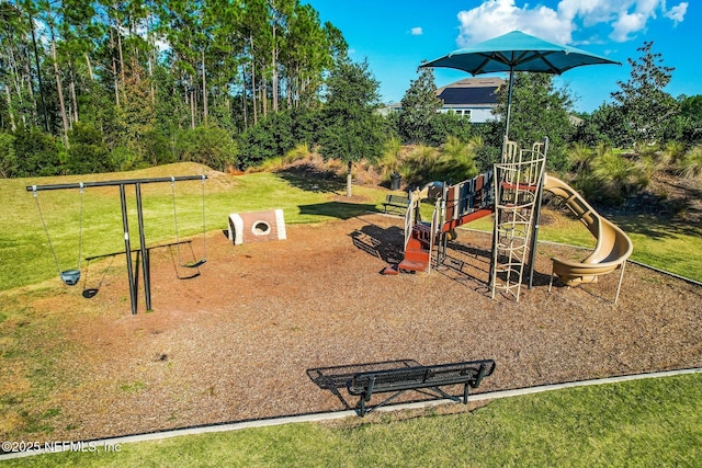 community jungle gym with a yard