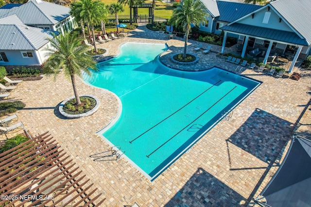 community pool featuring a patio area