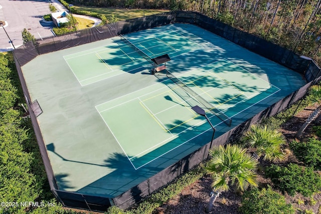 view of tennis court with fence