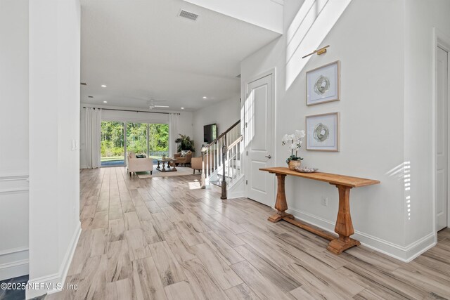 21 Mollusk Rd, Saint Johns, FL 32259 - hallway featuring stairs, recessed lighting, baseboards, wood finished floors, and visible vents