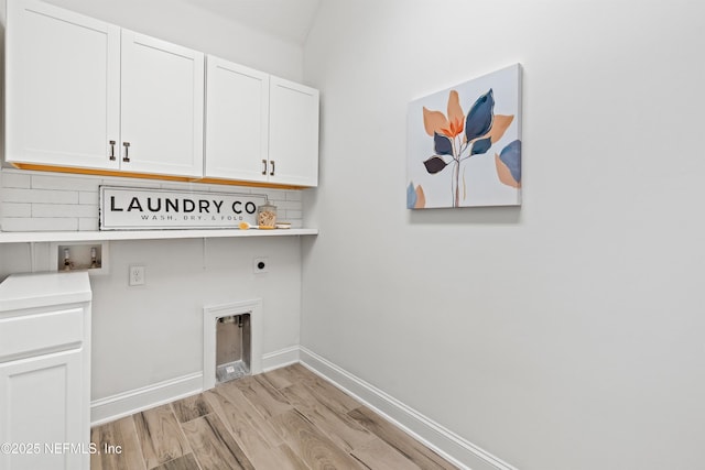 21 Mollusk Rd, Saint Johns, FL 32259 - laundry area with cabinet space, washer hookup, light wood finished floors, electric dryer hookup, and baseboards