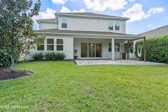 21 Mollusk Rd, Saint Johns, FL 32259 - rear view of house featuring a lawn and a patio area