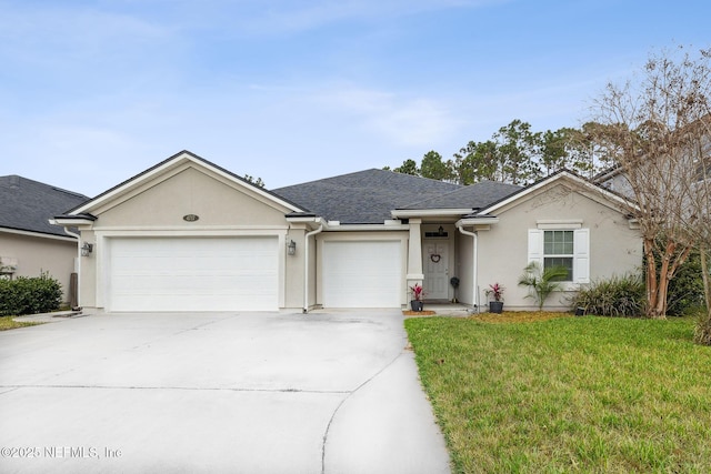 ranch-style home featuring a garage and a front lawn