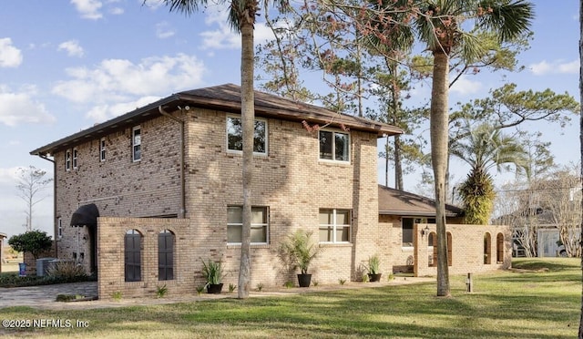 view of home's exterior with a lawn