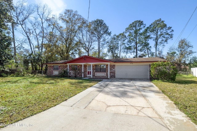 single story home featuring a garage and a front yard