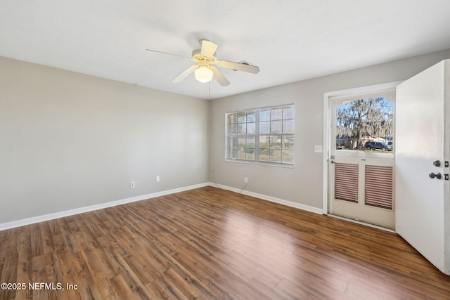 empty room with hardwood / wood-style floors and ceiling fan