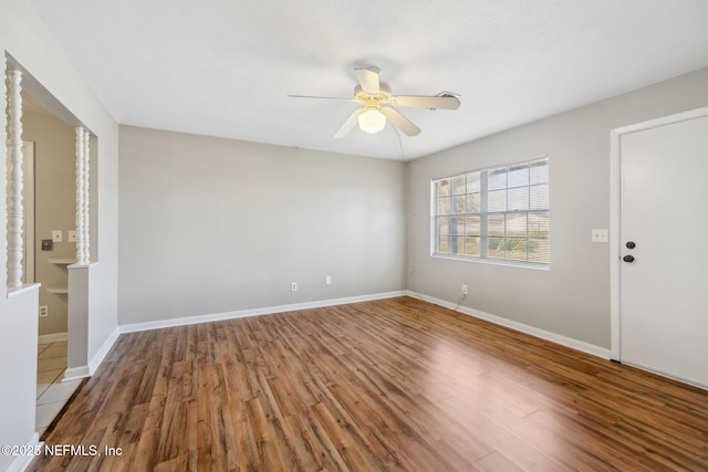 unfurnished room featuring hardwood / wood-style floors and ceiling fan