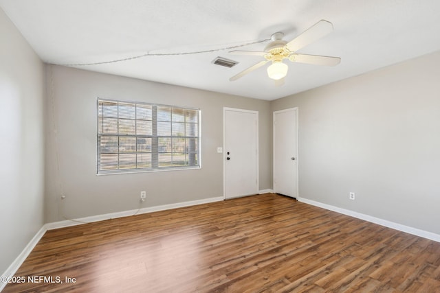 unfurnished room featuring hardwood / wood-style flooring and ceiling fan