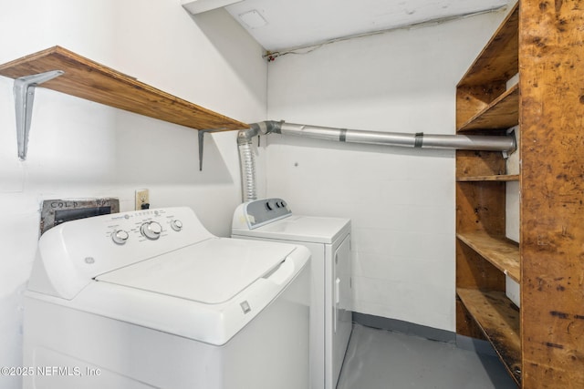 laundry area with independent washer and dryer