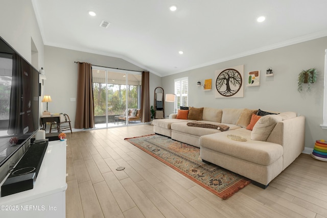 living room featuring crown molding, lofted ceiling, and light hardwood / wood-style flooring