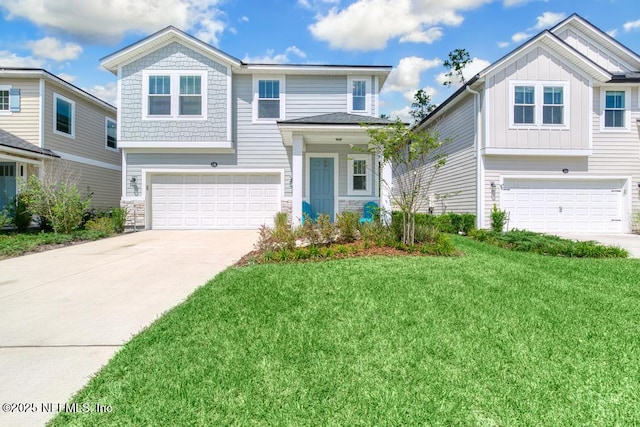 view of front of property with a garage and a front lawn