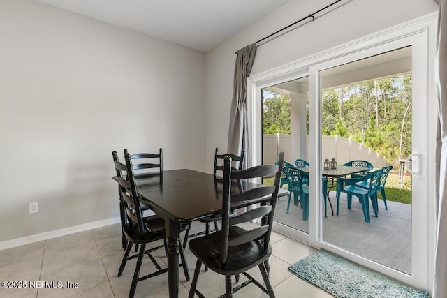 tiled dining room with plenty of natural light