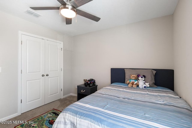 carpeted bedroom featuring a closet and ceiling fan