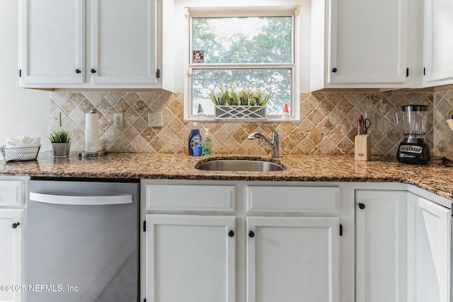 1045 17th St N, Jacksonville Beach, FL 32250 - kitchen with tasteful backsplash, stainless steel dishwasher, stone countertops, white cabinetry, and a sink