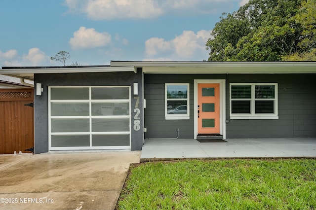 exterior space with a yard and a garage