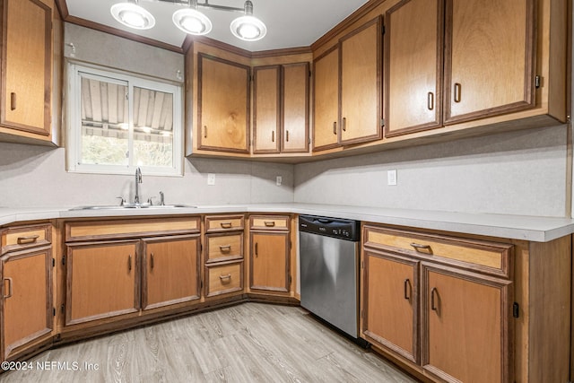 kitchen featuring dishwasher, sink, and light hardwood / wood-style floors