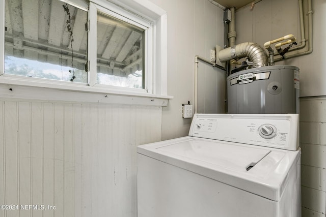 laundry room featuring washer / clothes dryer and water heater