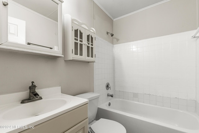 full bathroom with vanity, tiled shower / bath, crown molding, and toilet